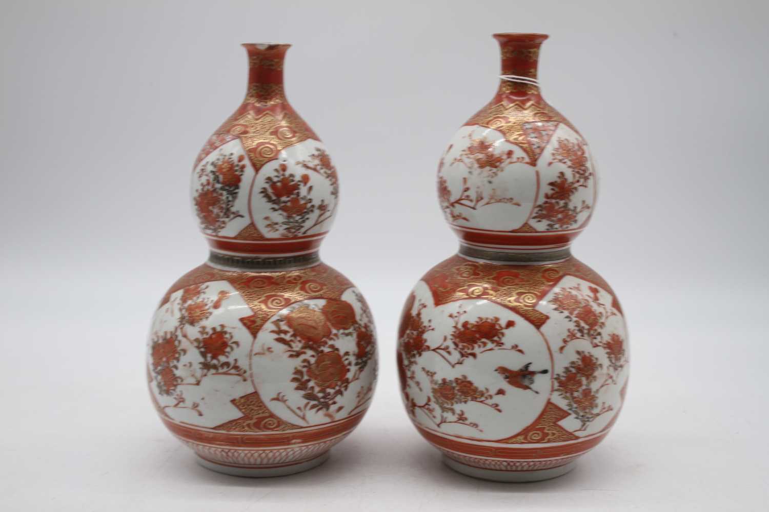 A pair of Japanese Meiji period Kutani double gourd vases signed verso, height 23cmBoth damaged - Image 2 of 3