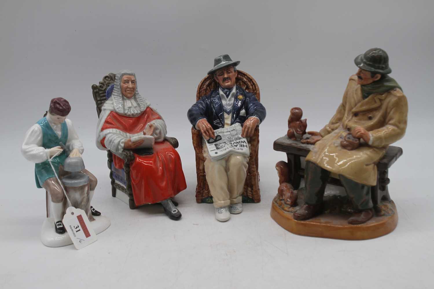 A collection of four Royal Doulton figures to include The Silversmith of Williamsburg, Lunchtime, - Image 2 of 3