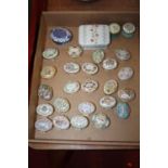 A collection of Halcyon Days enamel pill and patch boxes, largely being dated examples; Limoges