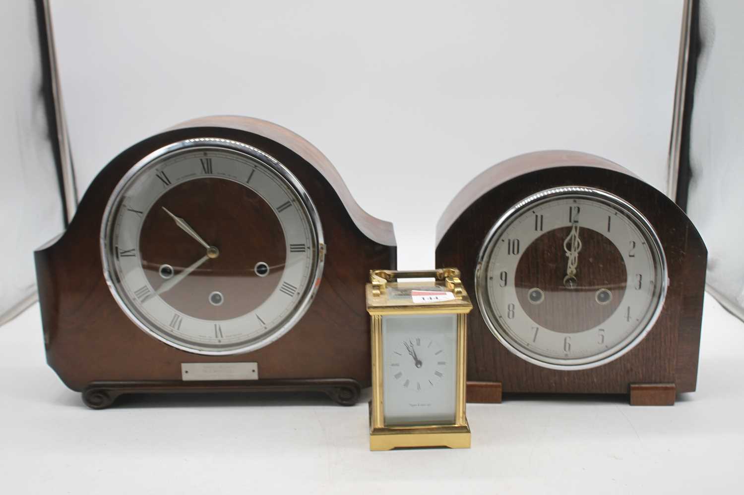 A Mappin & Webb lacquered brass cased carriage clock together with a oak cased mantel clock and