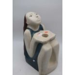 A 20th century Ken Patecky hollow moulded pottery model of a girl in seated pose, height 41cm