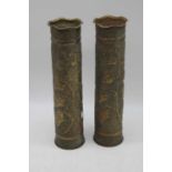 A pair of WWI trench art shell cases with stipple engraved decoration, height 35cm