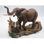 A Royal Doulton Nature's Heritage collection elephant with calf, h.26cm