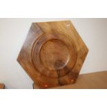 A contemporary walnut hexagonal table centrepiece, of good size, having polished-out centre, w.77cm