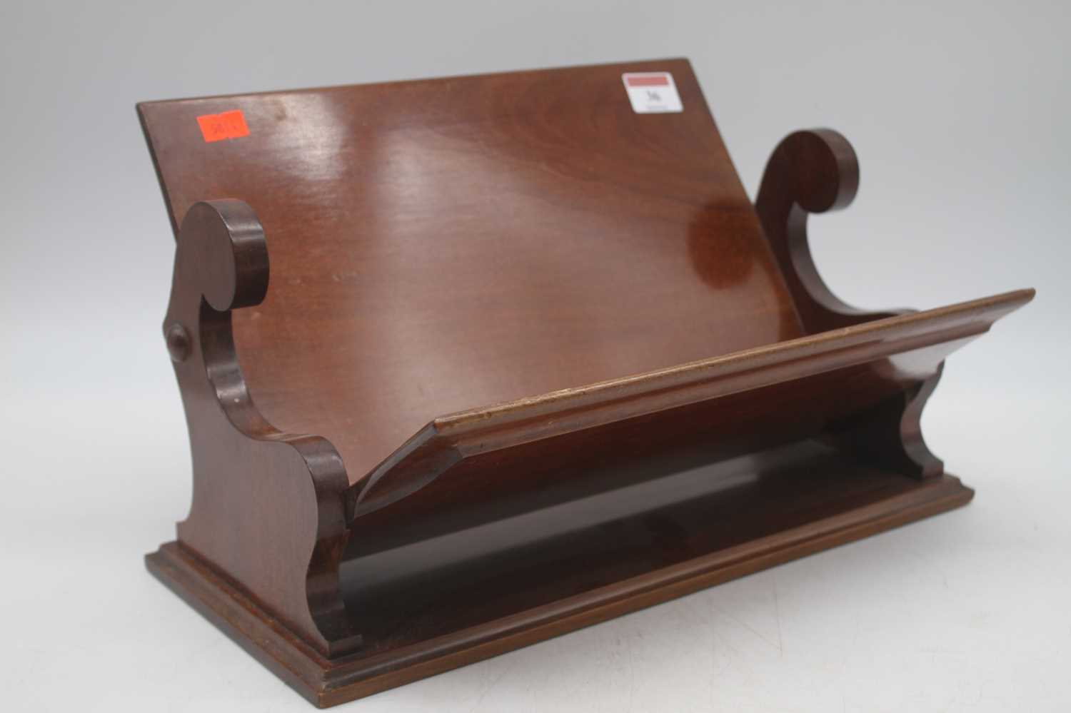 An Edwardian mahogany book trough, width 34cm