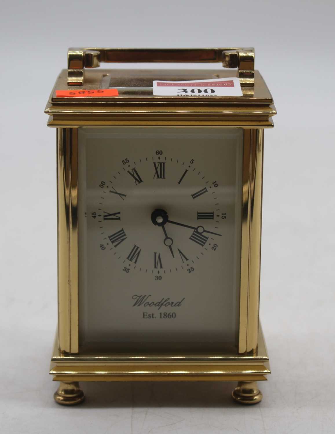 A Woodford reproduction lacquered brass carriage clock, h.12cm