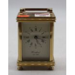 A Woodford reproduction lacquered brass carriage clock, h.12cm