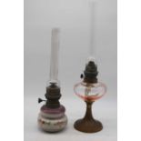 An early 20th century pigeon brass pedestal oil lamp together with one other (2)