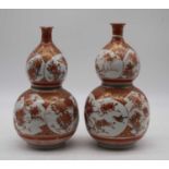 A pair of Japanese Meiji period Kutani double gourd vases signed verso, height 23cmBoth damaged