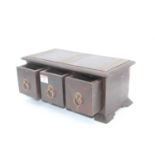 A hardwood and brass mounted three drawer table top chest, width 35cm