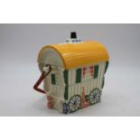 A moulded china biscuit box in the form of a Romany caravan