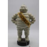 A reproduction painted cast iron Michelin Man figure, height 37cm