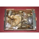 A box of miscellaneous metal ware to include 18th century and later brass candlesticks, chamber