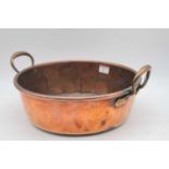 An early 20th century copper twin handled jam pan, width 39cm