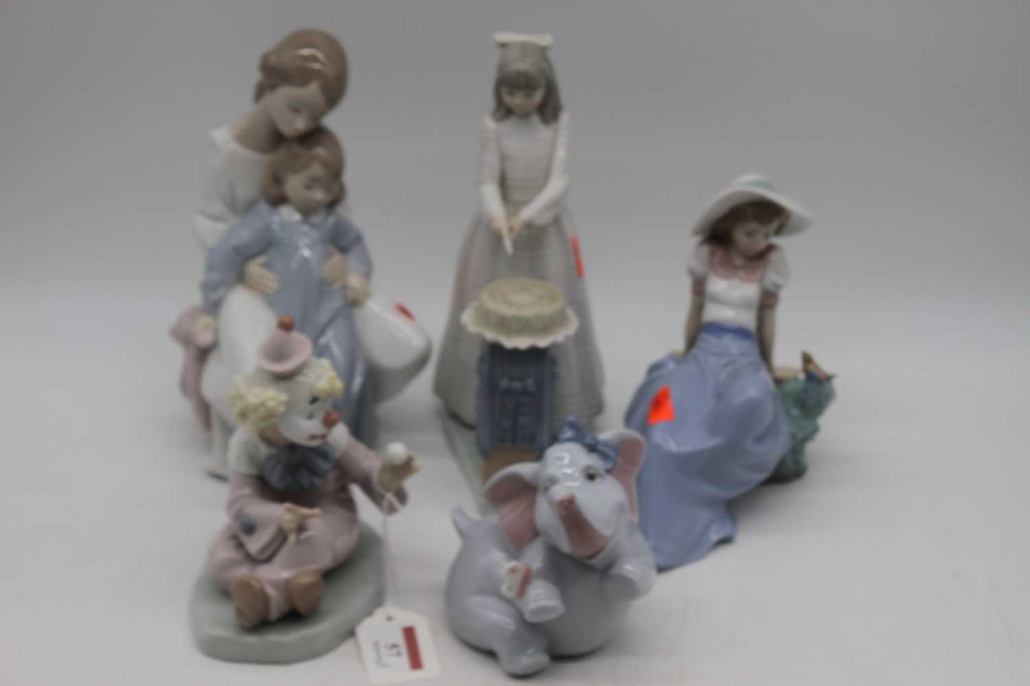 A collection of five Nao Spanish porcelain figures to include Clown, etc