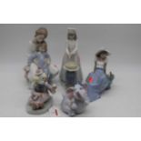 A collection of five Nao Spanish porcelain figures to include Clown, etc