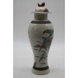A modern Chinese vase and cover of baluster form decorated with figures on horseback, height 32cm