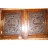 A pair of Edwardian carved oak panels