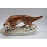 A large Royal Dux figure of a gun dog and duck having raised pink triangle mark verso, width 41cm