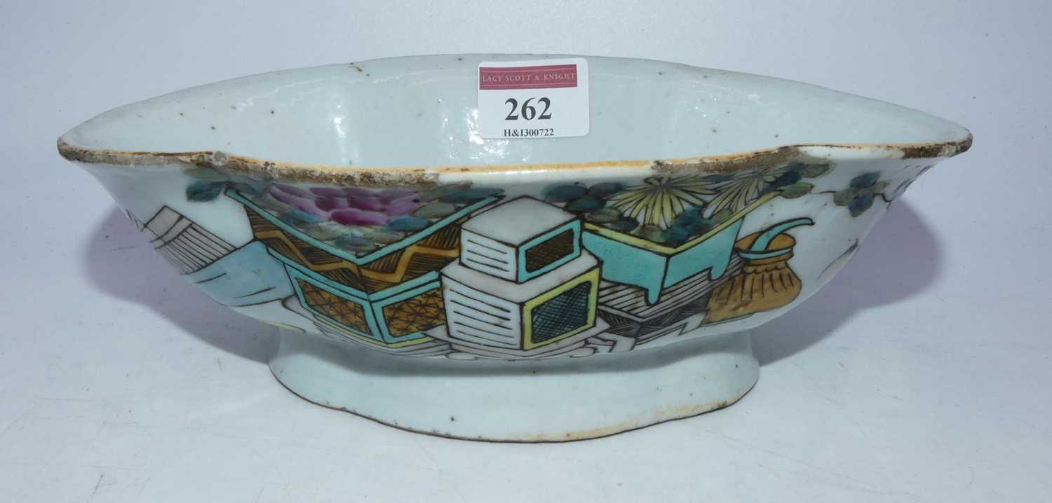A 19th century Chinese export stoneware bowl of shaped oval form, enamel decorated with a planter