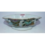 A 19th century Chinese export stoneware bowl of shaped oval form, enamel decorated with a planter