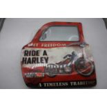 A reproduction advertising sign for Harley Davidson in the form of a car door