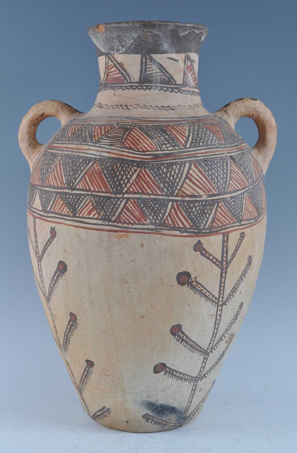 A large pottery twin handled vase of amphora shape, with traditional brushed painted bi-chrome