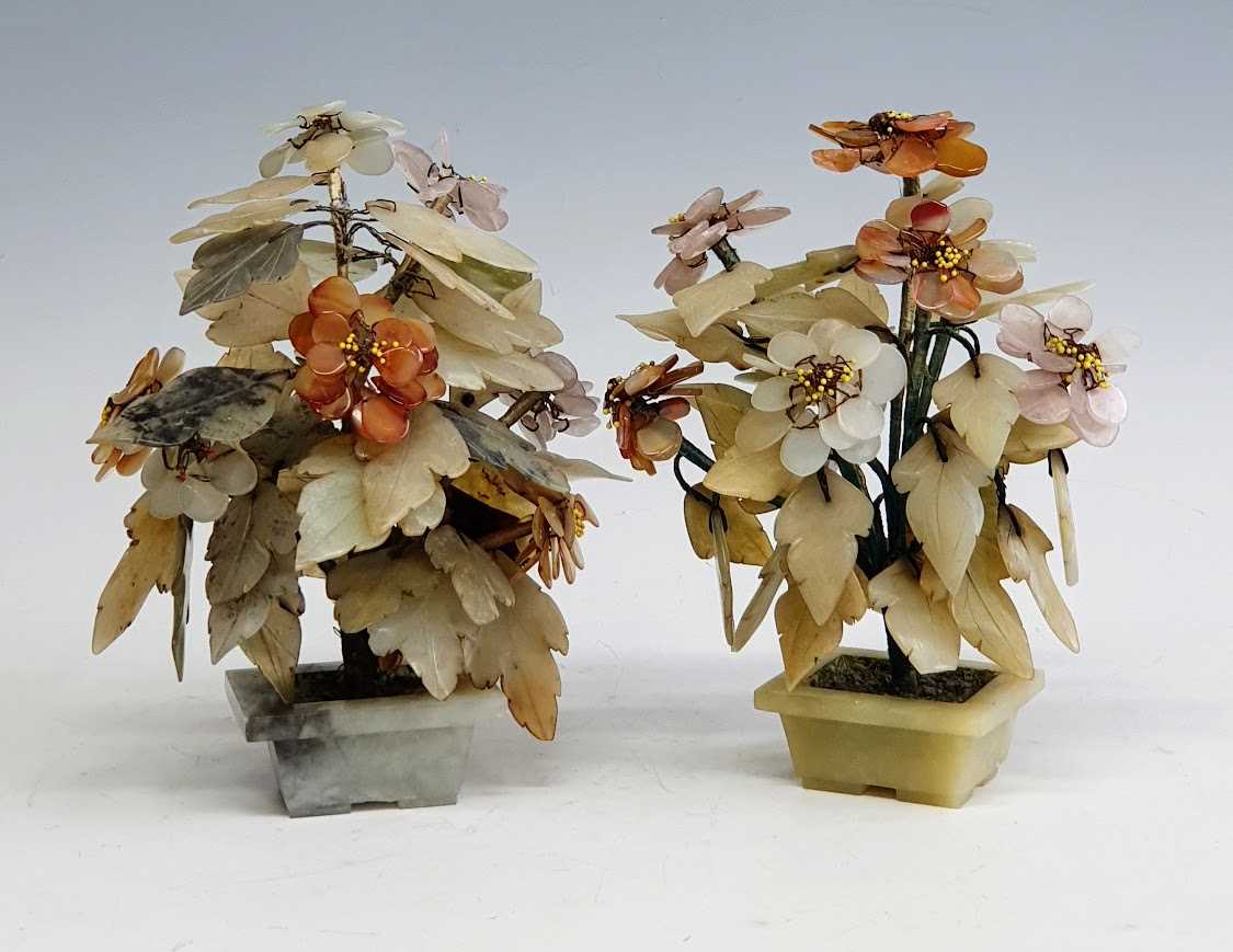 A pair of Chinese polished hardstone jardinieres of flowers, the flowerheads of varying hues