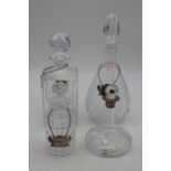 A small cut glass ship's decanter and stopper having silver collar, height 15cm, together with three