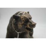 A brass alloy figure naturalistically modelled as a bear, length 34cm