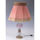 A 20th century cut crystal and gilt metal table lamp, of baluster form, the pleated shade above a