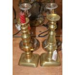 A pair of Victorian turned brass candlesticks, height 24cm, together with a pair of Old Sheffield