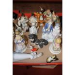 A collection of assorted figurines to include resin figure of cat and kittens, Szeiler figure of a