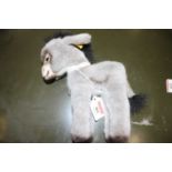 A Steiff donkey, with yellow label numbered 3605/20, h.20cmIn good condition, no apparent losses.