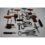 A collection of vintage & modern corkscrews and openers to include an early Scweppes, Crown cork &
