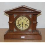 An early 20th century oak cased 8-day mantel clock, of architectural form, h.33cm