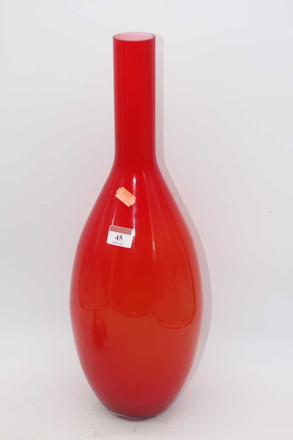 A large orange tinted art glass bottle vase, height 51cm