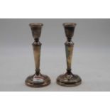 A pair of loaded silver candlesticks, h.19cm