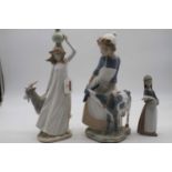 A large Nao figure of a girl with goat together with one other similar, and Lladro figure of girl