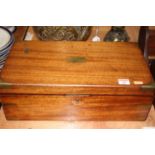 A Victorian mahogany and brass bound writing slope having partially fitted interior