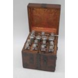 An eastern hardwood and metal mounted apothecary chest, the hinged lid opening to reveal fitted