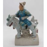 A Ming? dynasty pottery ridge tile in the form of a warrior on horseback (later painted) height