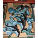 A collection of Poole Pottery figures to include dolphins, otter, etc