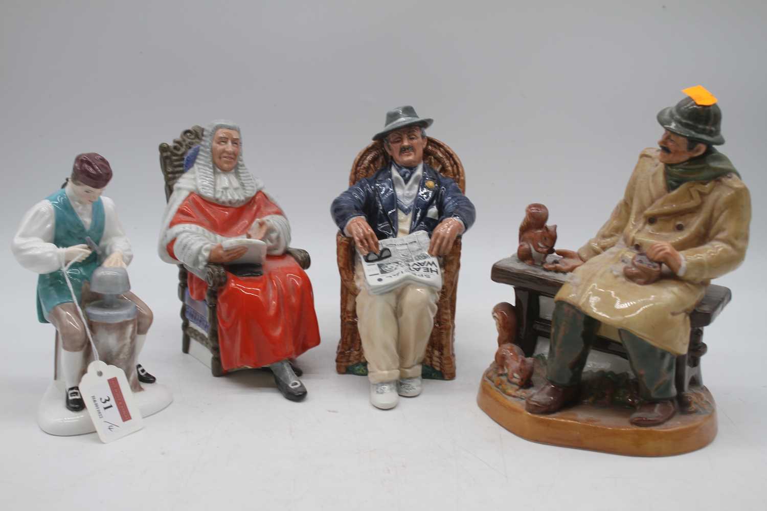 A collection of four Royal Doulton figures to include The Silversmith of Williamsburg, Lunchtime,