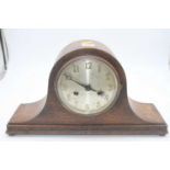 A 1920s oak cased mantel clock