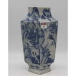 A Chinese export vase of slab sided form, under glaze blue decorated with figures within a landscape