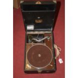 An HMV portable wind-up gramophone