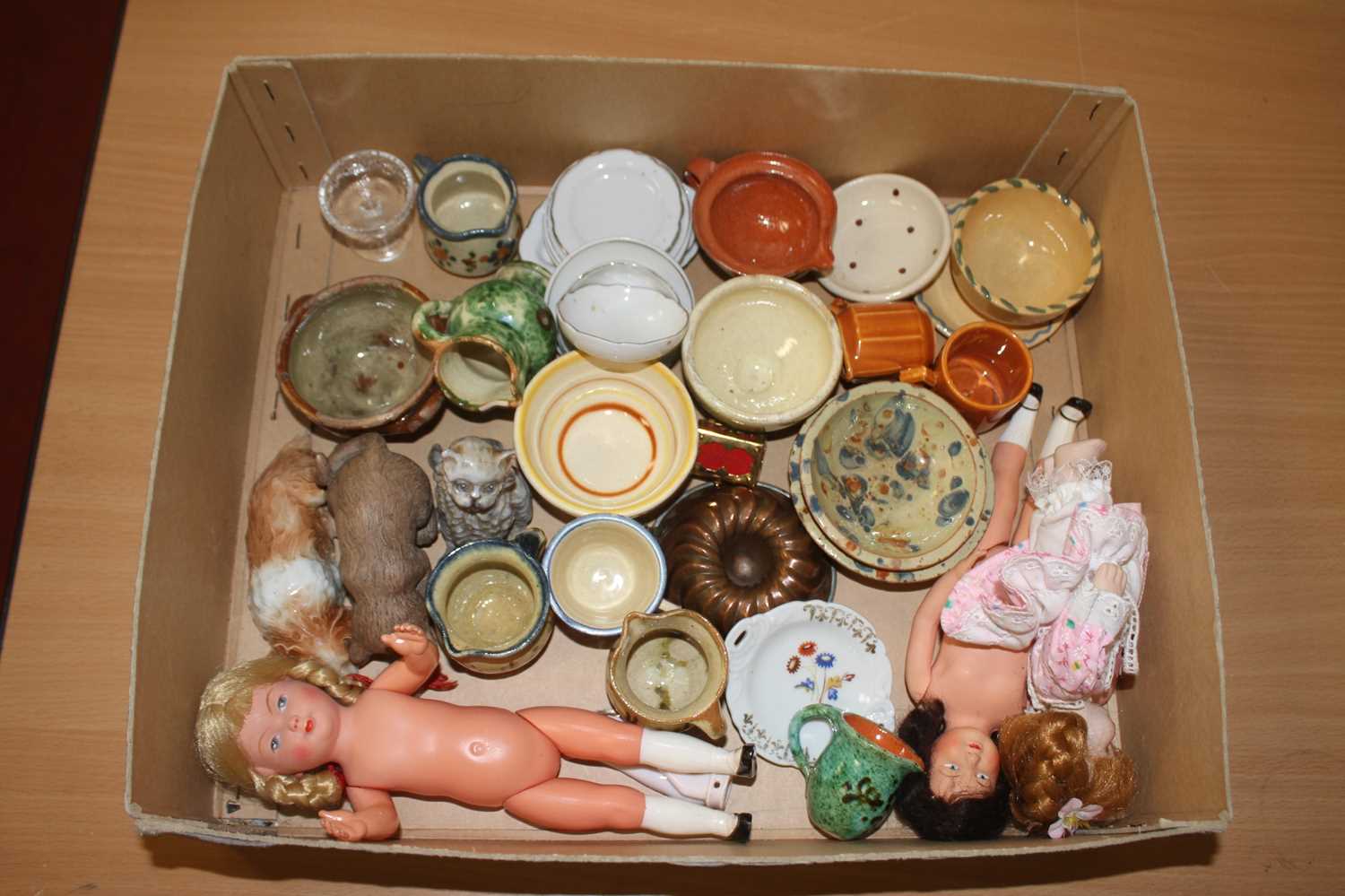 Assorted miniature pottery wares, china ornaments, miniature celluloid dolls etc