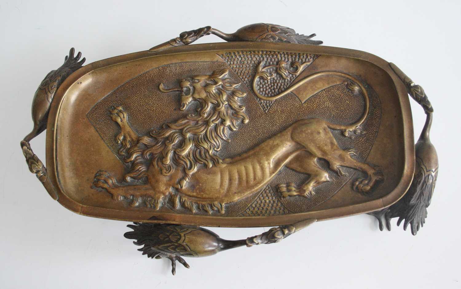 A Japanese Meiji period bronze stand, the centre cast in relief with a lion, the whole supported - Image 2 of 3