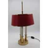 A lacquered brass three light table lamp and shade